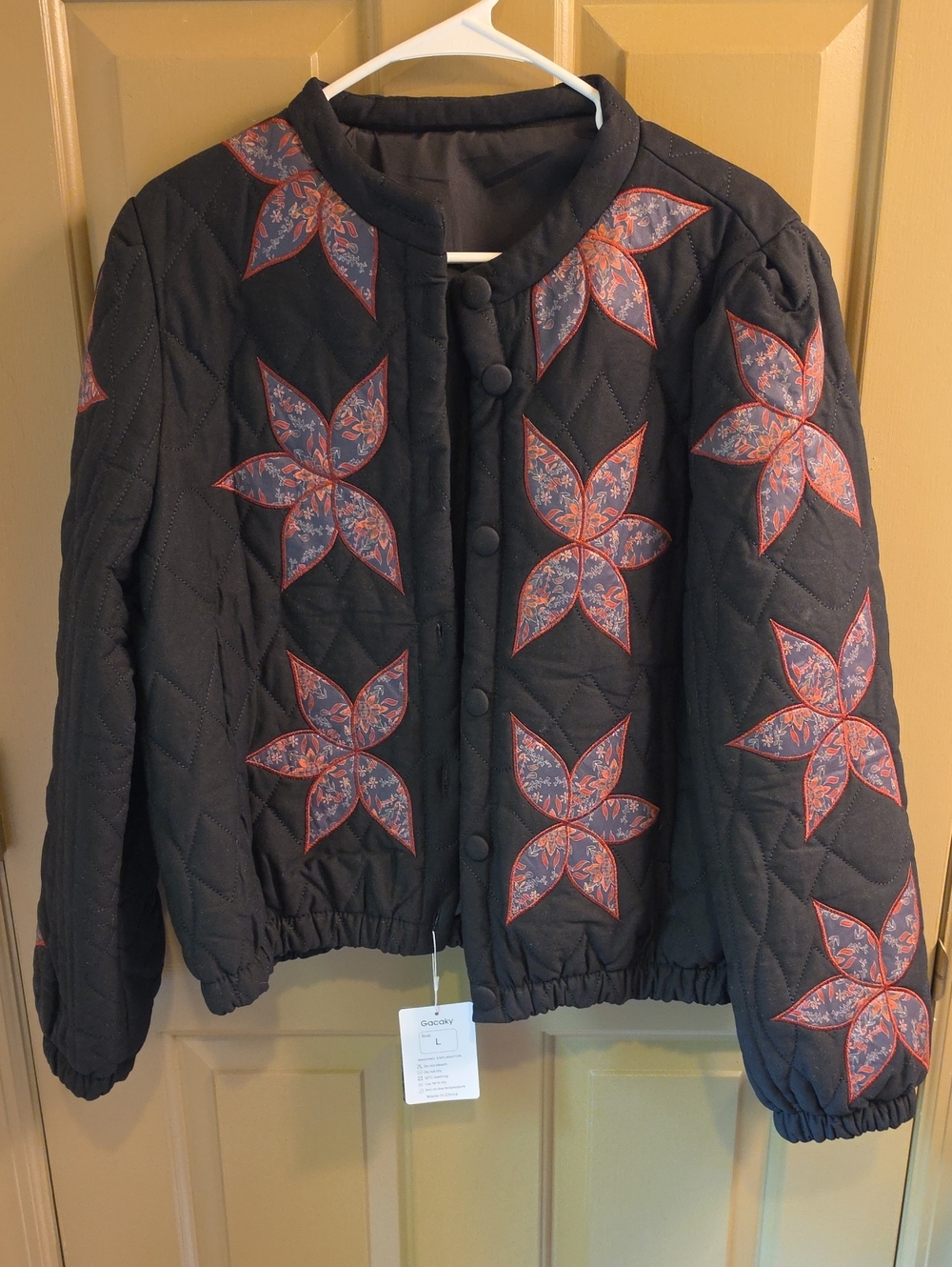 Quilted Floral Patch Puffer Jacket - Black with Red/Blue Floral Motifs